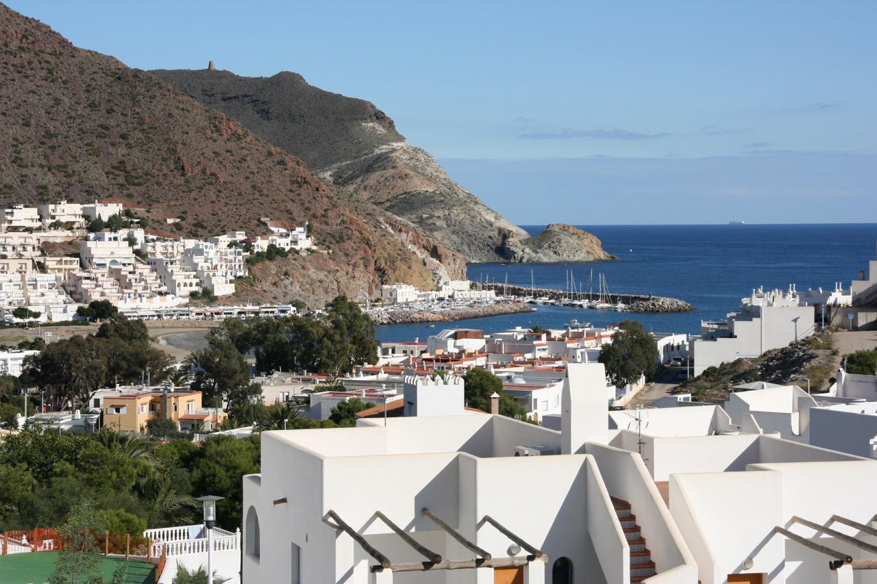 San José coastline, Cabo de Gata, harbour and houses with mountain backdrop