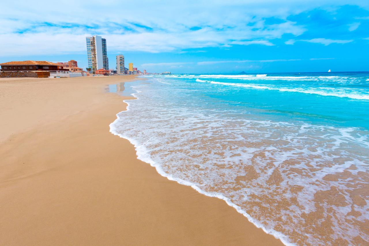 Waves swell over the pristine beach of La Manga, Murcia